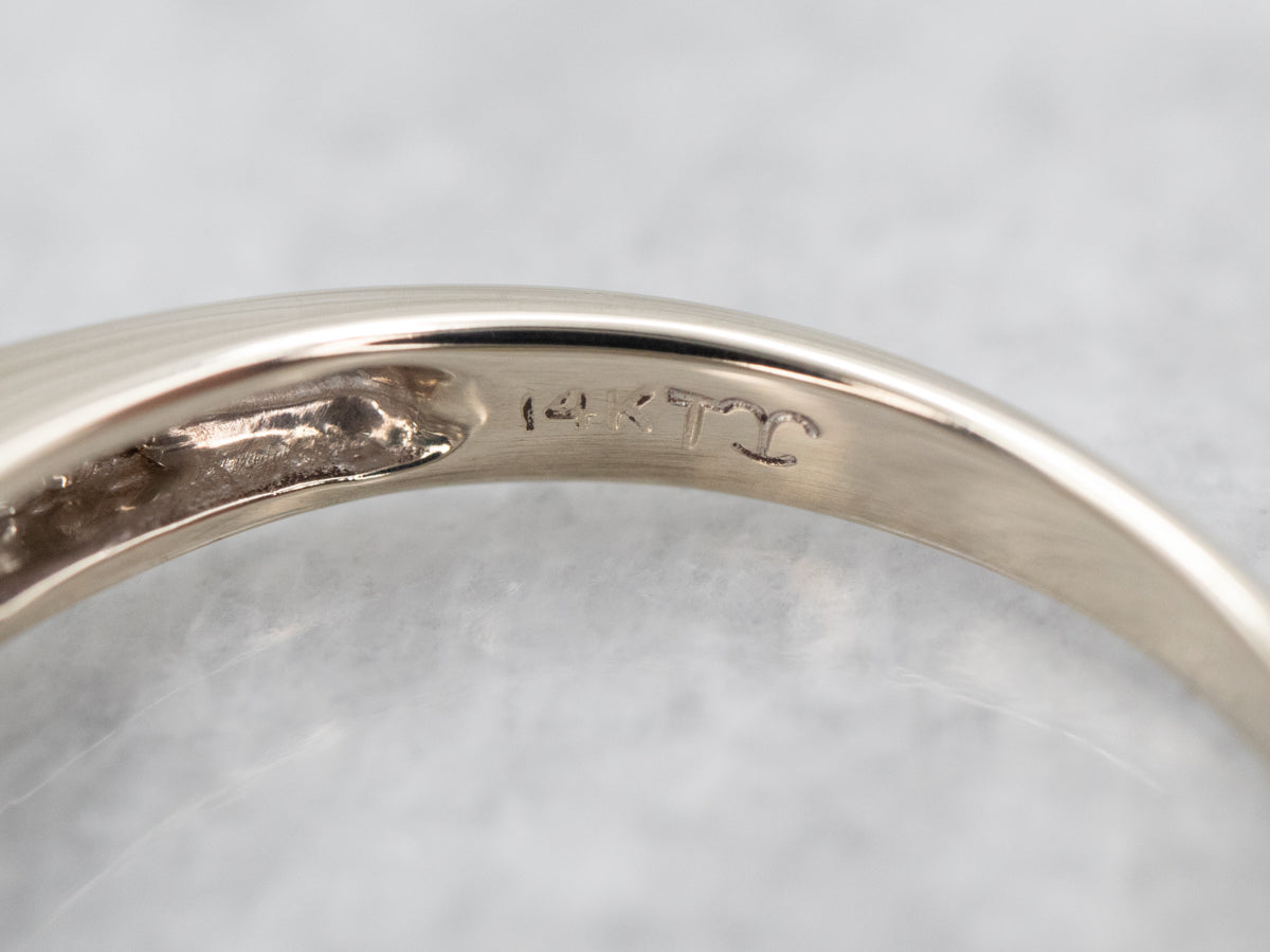 Striking White Gold Tanzanite Ring with Diamond Accents