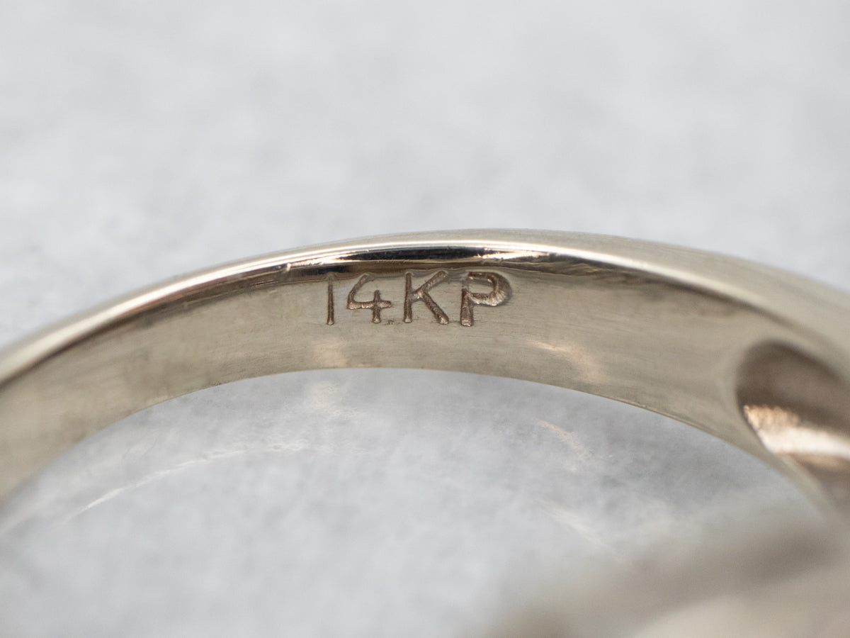 Modern Sapphire and Diamond Halo Engagement Ring