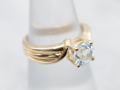 Polished Gold Blue Topaz Solitaire Bypass Ring