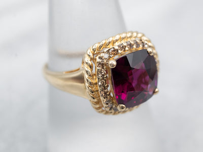 Eye-Catching Yellow Gold Rhodolite Garnet Ring with Diamond Halo