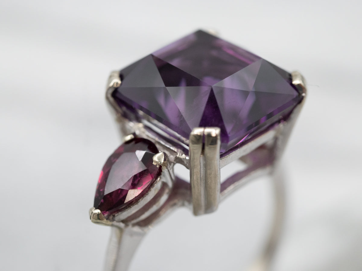 Expertly Crafted White Gold Amethyst Cocktail Ring with Garnet Accents