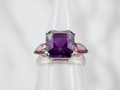 Expertly Crafted White Gold Amethyst Cocktail Ring with Garnet Accents