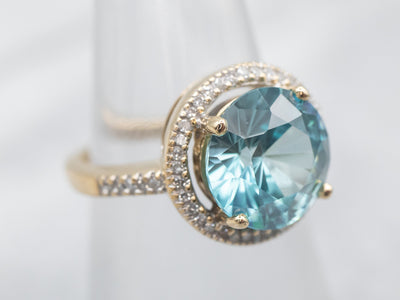Stunning Blue Zircon and Diamond Halo Ring