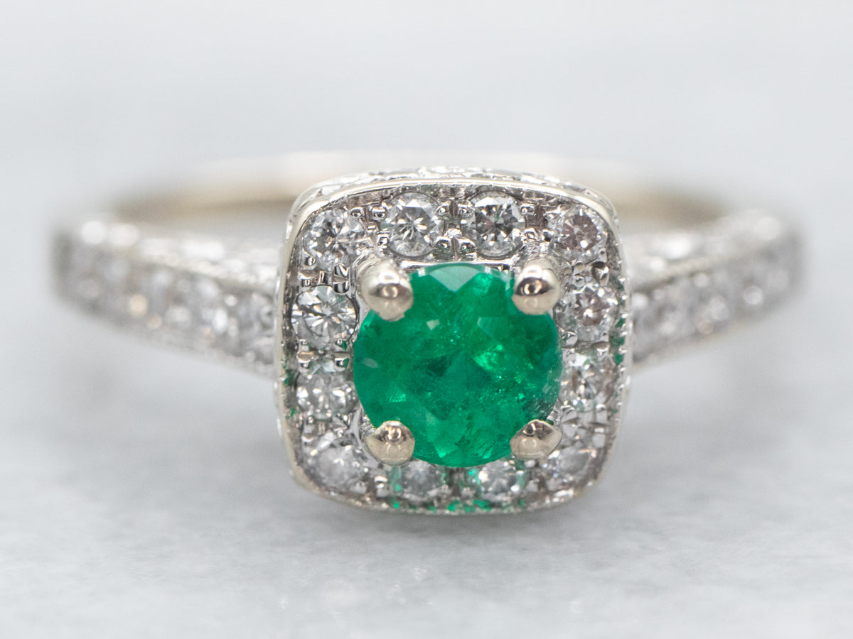 Modern Emerald and Diamond Halo Engagement Ring