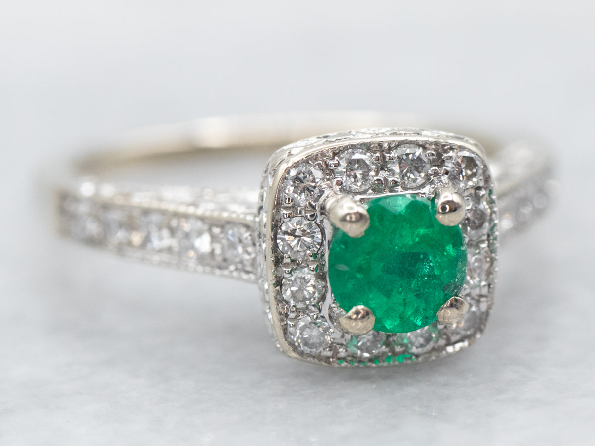 Modern Emerald and Diamond Halo Engagement Ring