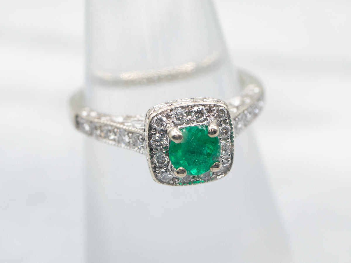 Modern Emerald and Diamond Halo Engagement Ring