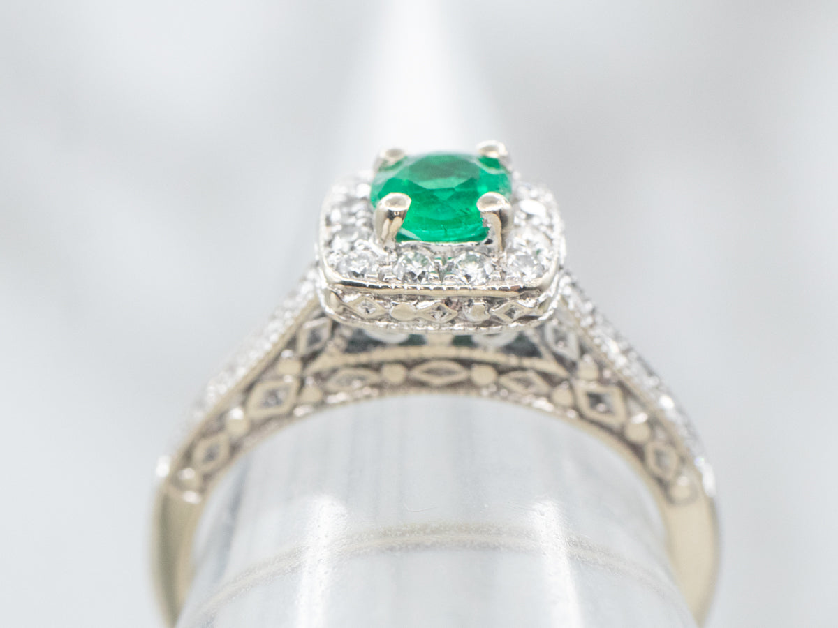 Modern Emerald and Diamond Halo Engagement Ring