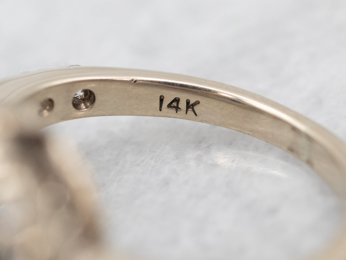 Classic Sapphire and Diamond Halo Engagement Ring