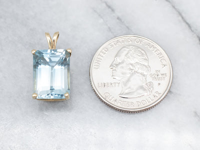 Sophisticated Yellow Gold Blue Topaz Solitaire Pendant