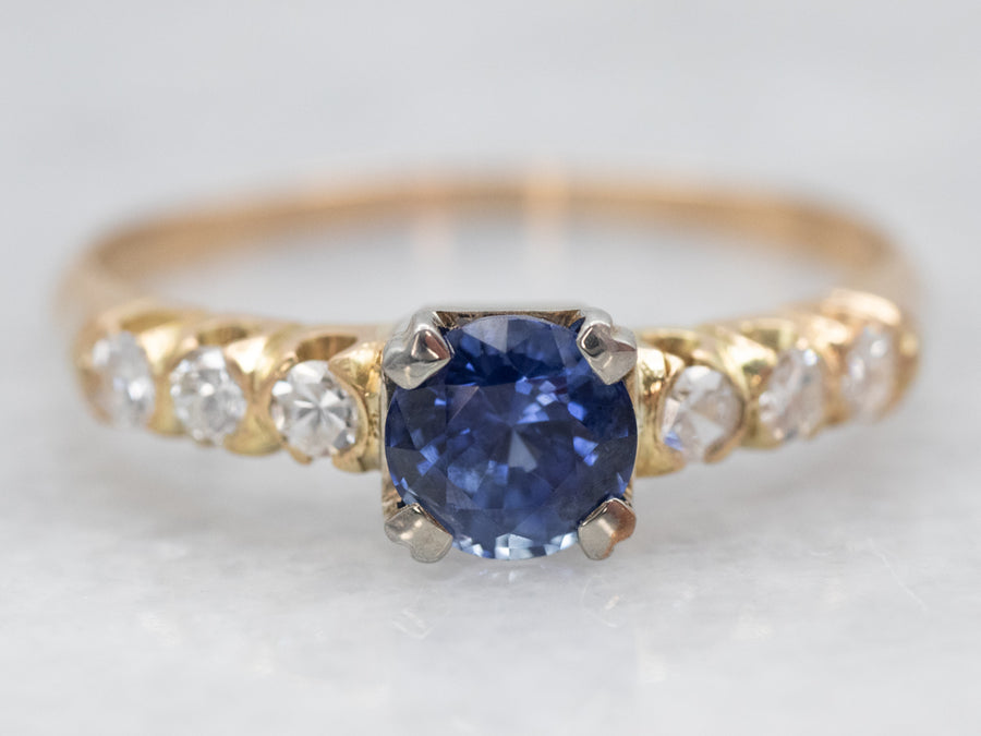 Two Tone Yellow and White Gold Round Cut Sapphire Engagement Ring with Diamond Accents