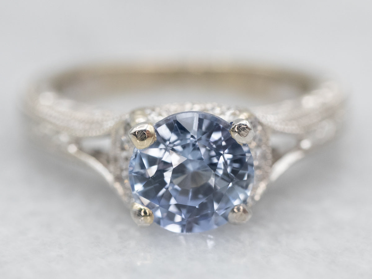 Gorgeous White Gold Sapphire Engagement Ring with Diamond Accents and Decorated Shoulders