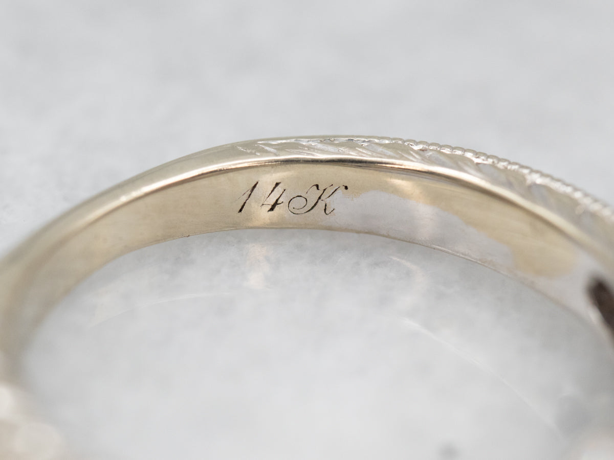 Gorgeous White Gold Sapphire Engagement Ring with Diamond Accents and Decorated Shoulders