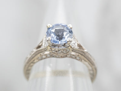 Gorgeous White Gold Sapphire Engagement Ring with Diamond Accents and Decorated Shoulders