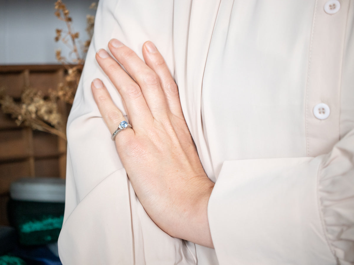 Gorgeous White Gold Sapphire Engagement Ring with Diamond Accents and Decorated Shoulders