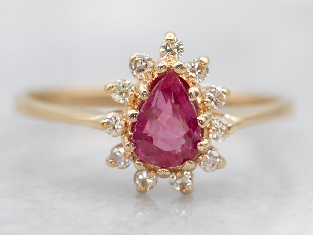 Luxurious Yellow Gold Pear Cut Pink Sapphire Ring with Diamond Halo