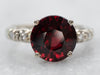 Delicate White Gold Garnet Ring with Diamond Accents
