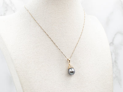 Yellow Gold Black Pearl Pendant with Diamond Accent