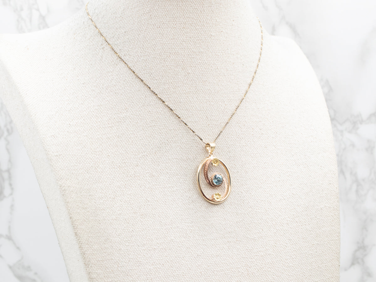 Two Tone Blue Zircon Swirl Pendant with Flower Accents