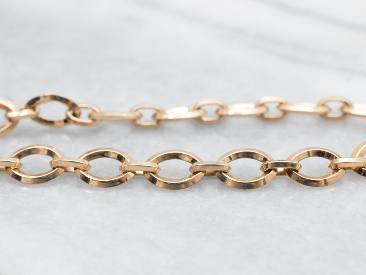 Pulsera de eslabones ovalados de oro vintage con cadena de seguridad