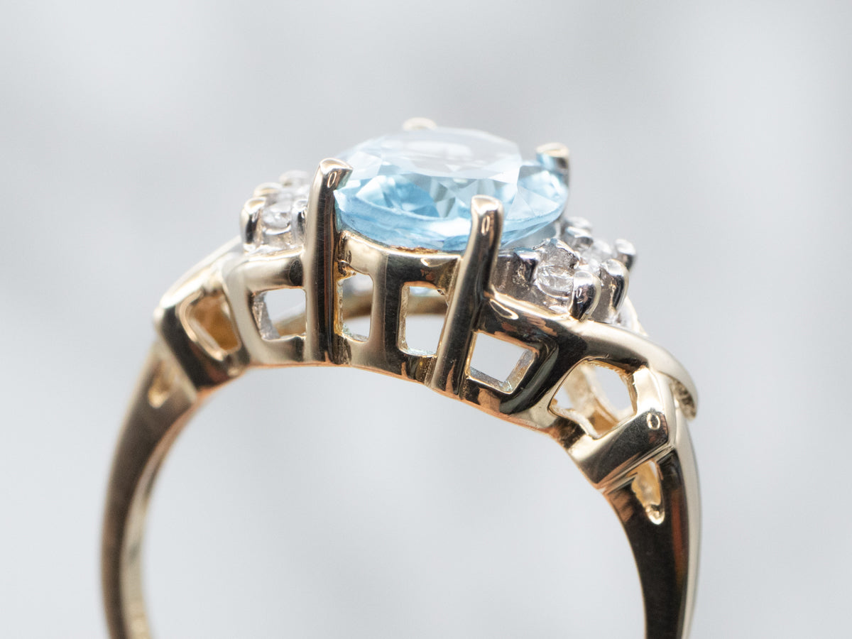 Yellow Gold Blue Topaz Ring with Diamond Accents