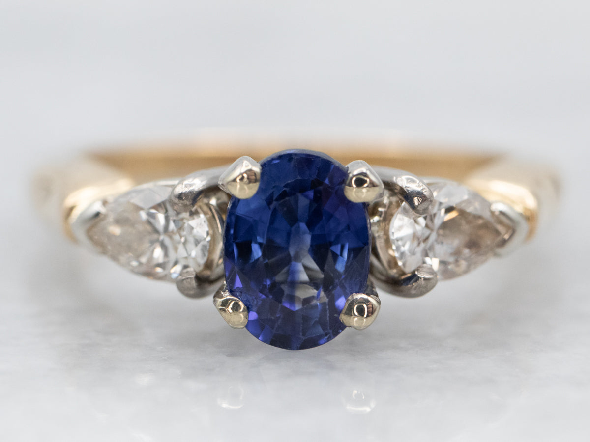 Two Tone Sapphire Engagement Ring with Pear Cut Diamond Accents