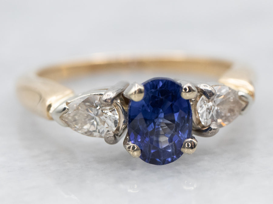 Two Tone Sapphire Engagement Ring with Pear Cut Diamond Accents