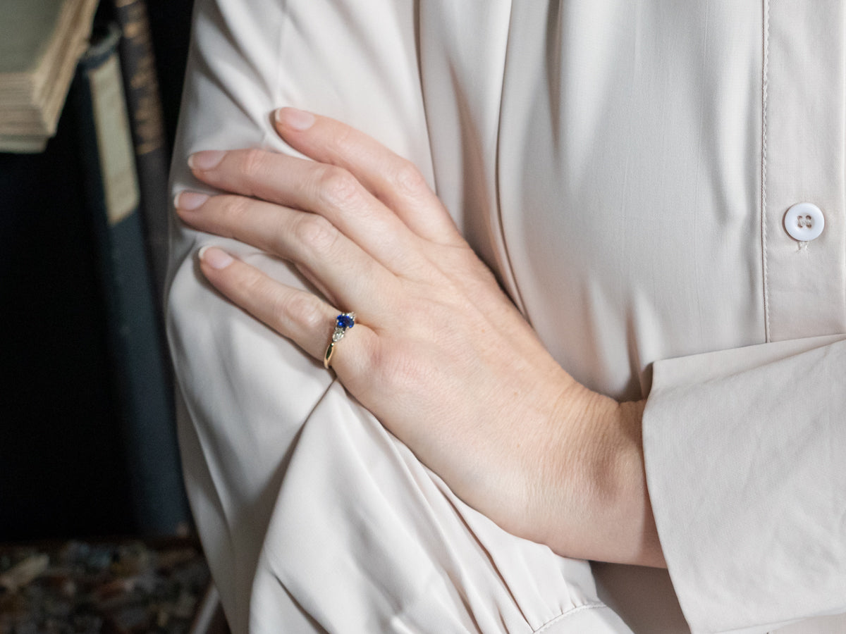 Two Tone Sapphire Engagement Ring with Pear Cut Diamond Accents