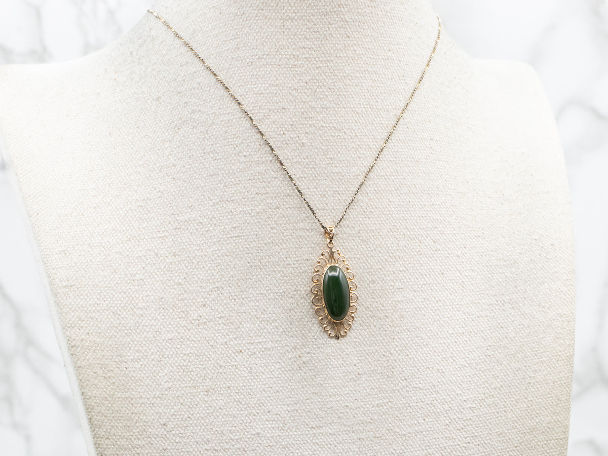 Yellow Gold Jade Pendant with Scrolling Frame