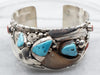 Sterling Silver Navajo Turquoise, Coral, and Faux Bear Claw Cuff Bracelet