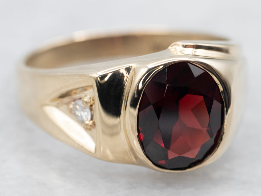 Yellow Gold Bezel Set Oval Cut Pyrope Garnet Ring with Diamond Accent