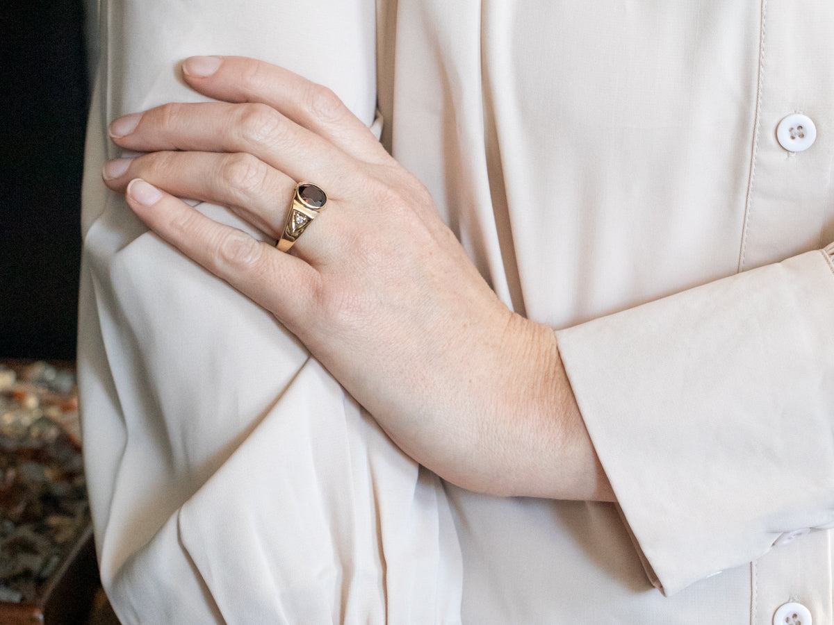 Yellow Gold Bezel Set Oval Cut Pyrope Garnet Ring with Diamond Accent
