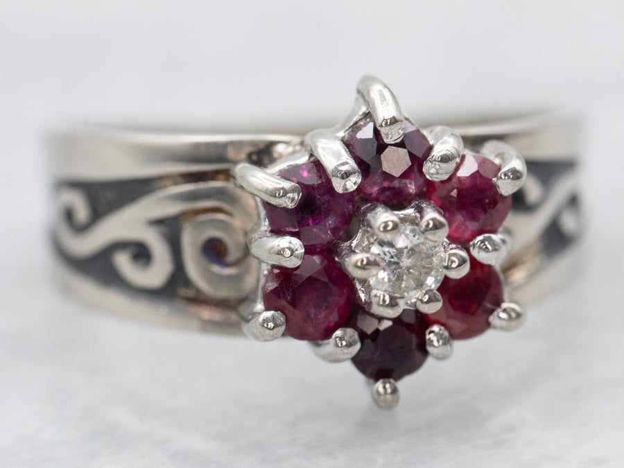 White Gold Ruby and Diamond Flower Ring with Diamond Accent and Swirling Shoulders