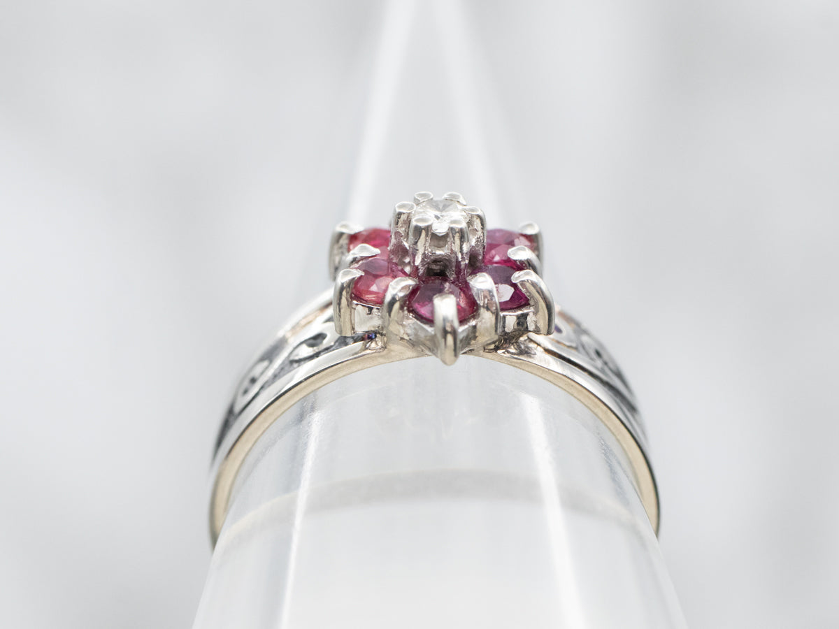 White Gold Ruby and Diamond Flower Ring with Diamond Accent and Swirling Shoulders