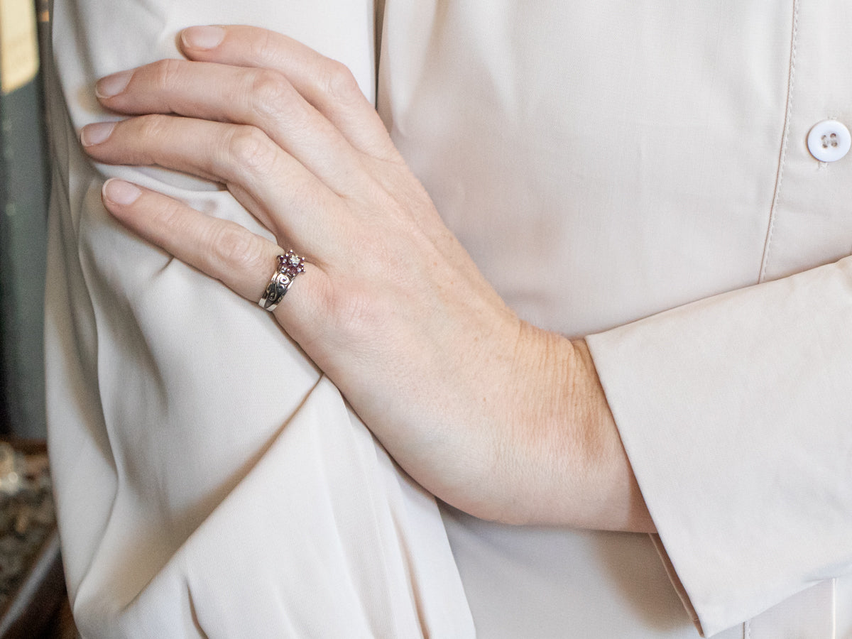 White Gold Ruby and Diamond Flower Ring with Diamond Accent and Swirling Shoulders