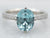 White Gold Oval Cut Blue Zircon Ring with Diamond Shoulders