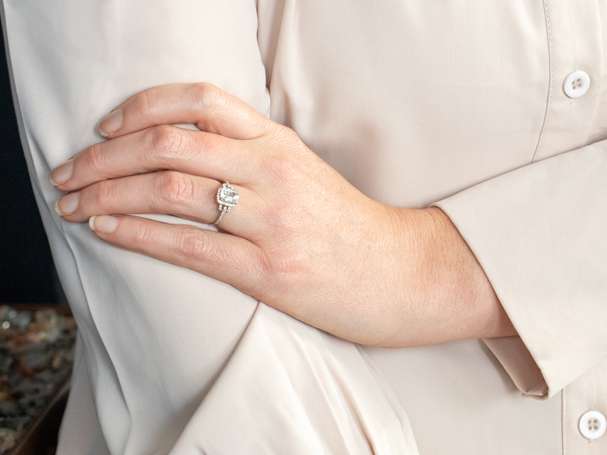 White Gold Emerald Cut Aquamarine Ring with Diamond Halo and Diamond Shoulders