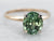 Yellow and White Gold Oval Cut Green Tourmaline Solitaire Ring