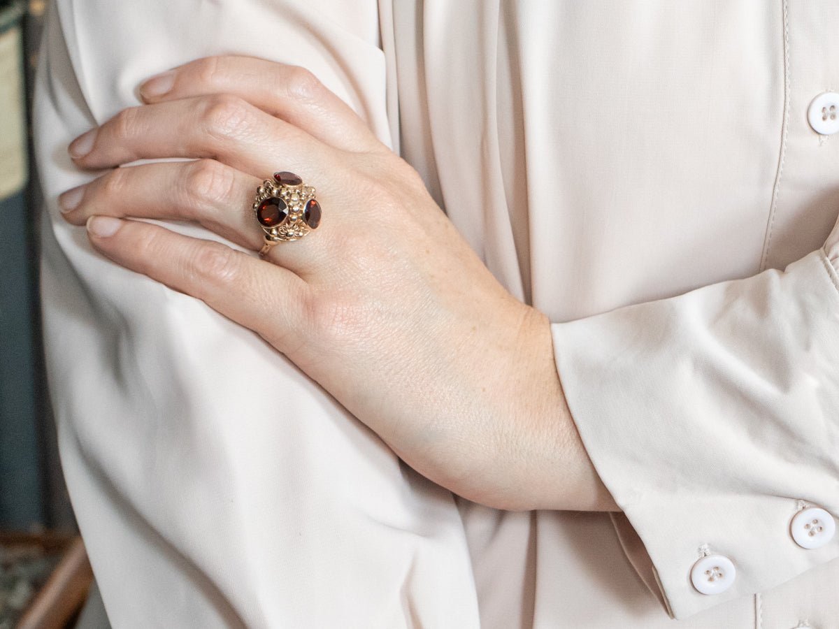 Yellow Gold Bezel Set Oval Cut Pyrope Garnet Dome Ring