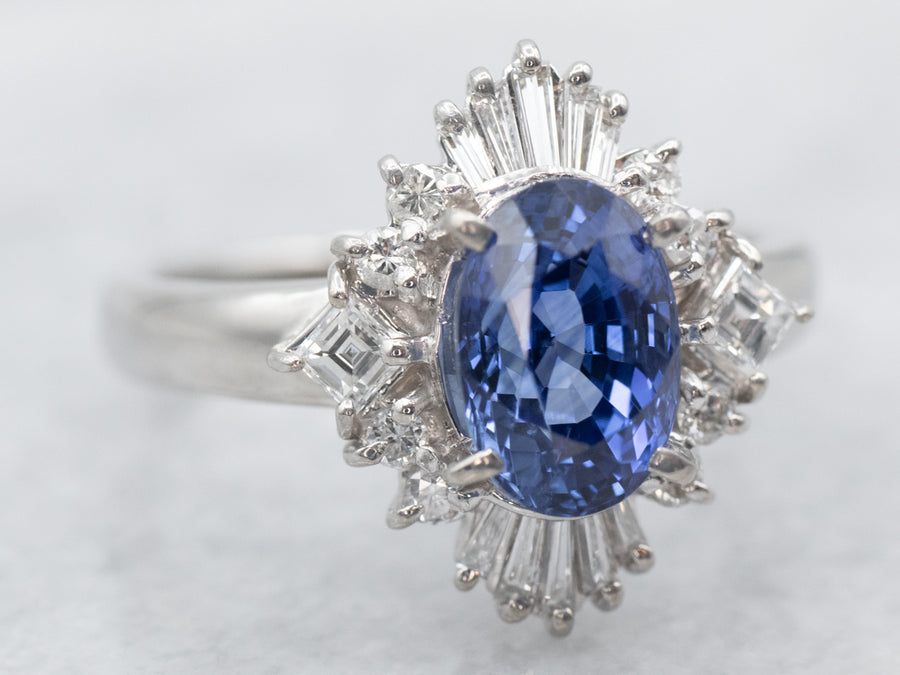 Platinum Oval Cut Sapphire Engagement Ring with Round and Baguette Cut Diamond Halo