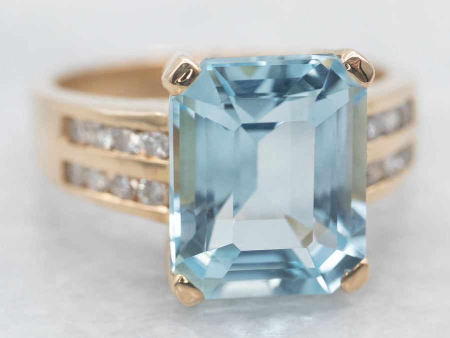 Yellow Gold Emerald Cut Blue Topaz Ring with Diamond Shoulders