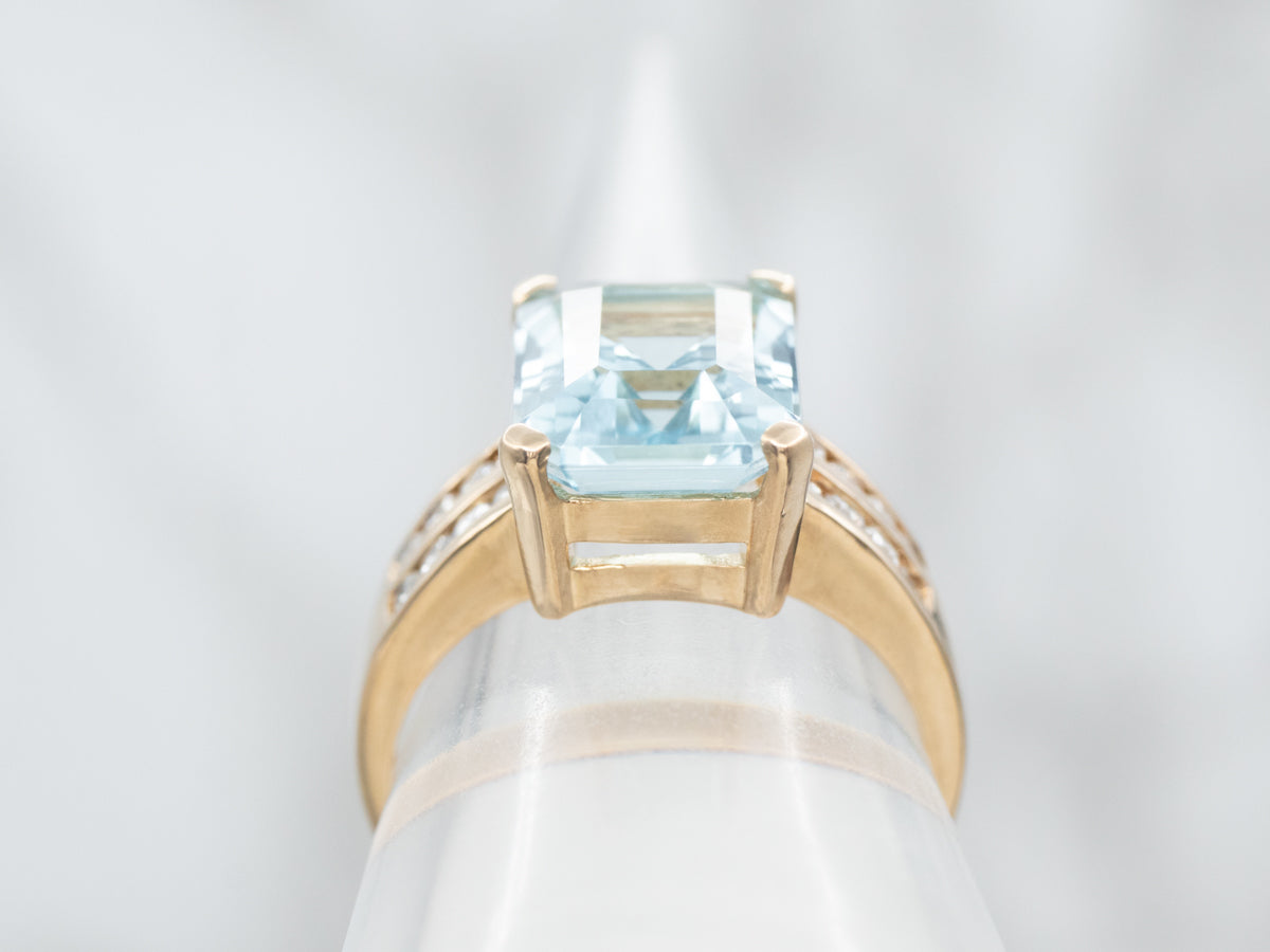 Yellow Gold Emerald Cut Blue Topaz Ring with Diamond Shoulders