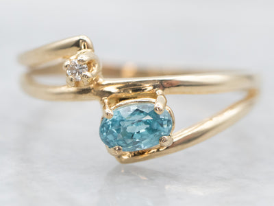 Yellow Gold East West Blue Zircon Bypass Ring with Diamond Accent