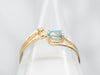 Yellow Gold East West Blue Zircon Bypass Ring with Diamond Accent