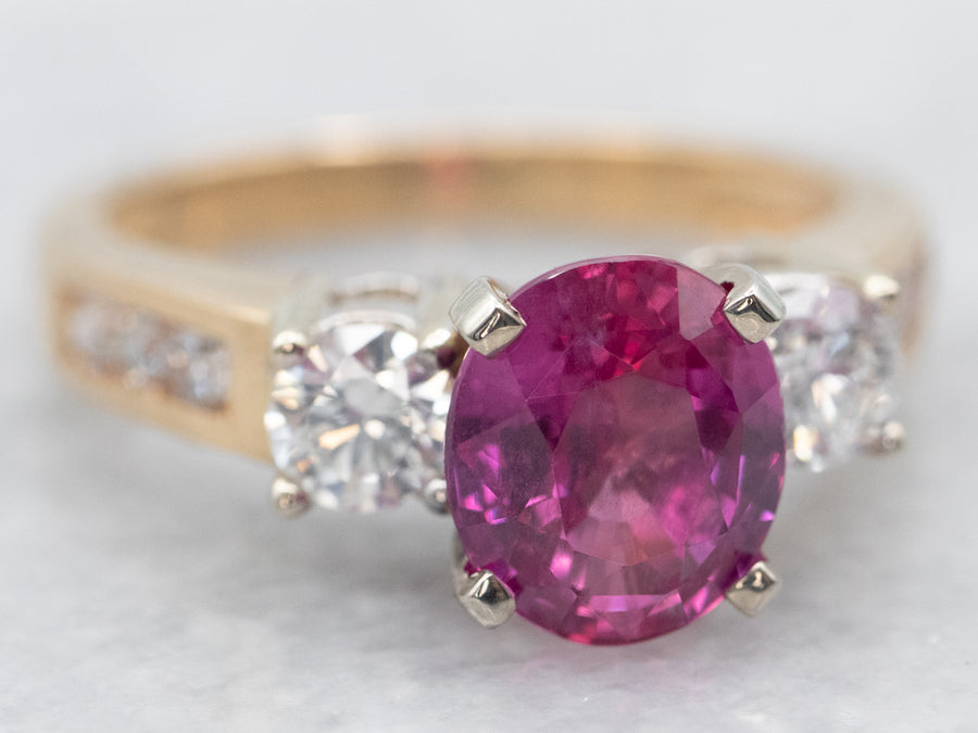 Two Tone Oval Cut Pink Sapphire and Diamond Ring with Channel Set Diamond Shoulders