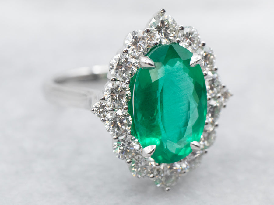 White Gold Oval Cut Emerald Ring with Diamond Halo