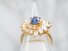 Yellow Gold Oval Cut Sapphire Engagement Ring with Marquise and Round Cut Diamond Halo
