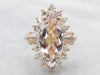 Yellow Gold Marquise Cut Morganite Ring with Round and Baguette Cut Diamond Halo