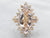 Yellow Gold Marquise Cut Morganite Ring with Round and Baguette Cut Diamond Halo