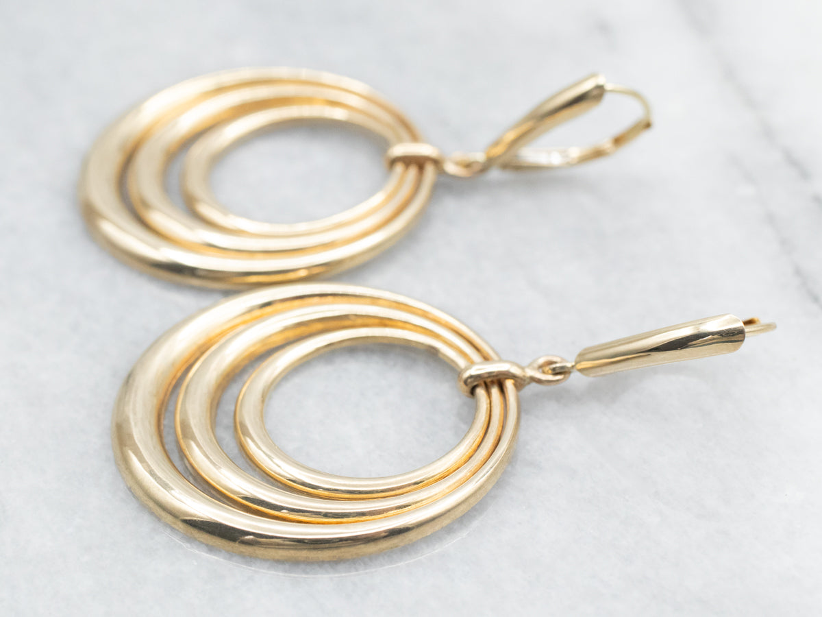 Pendientes colgantes de oro amarillo con triple círculo