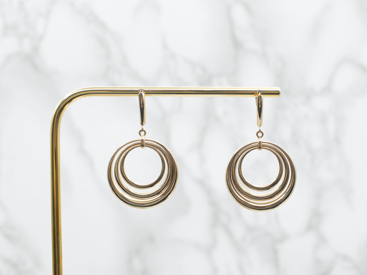 Pendientes colgantes de oro amarillo con triple círculo